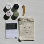 Featuring ELIA 15g deodorant collection range (from left to right and top to bottom) Pure Deodorant (white), Activated Charcoal Deodorant (black), Abundance Bicarb Free Deodorant (pink), and Conscious Bicarb Free Deodorant (green). With Ingredients card and ELIA Calico bag.