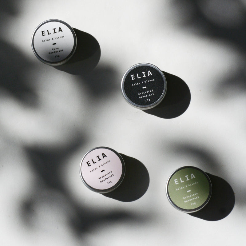 Featuring ELIA 15g deodorant collection range ( from left to right and top to bottom) Pure Deodorant (white), Activated Charcoal Deodorant ( black), Abundance Bicarb Free Deodorant (pink), and Conscious Bicarb Free Deodorant (Green). 